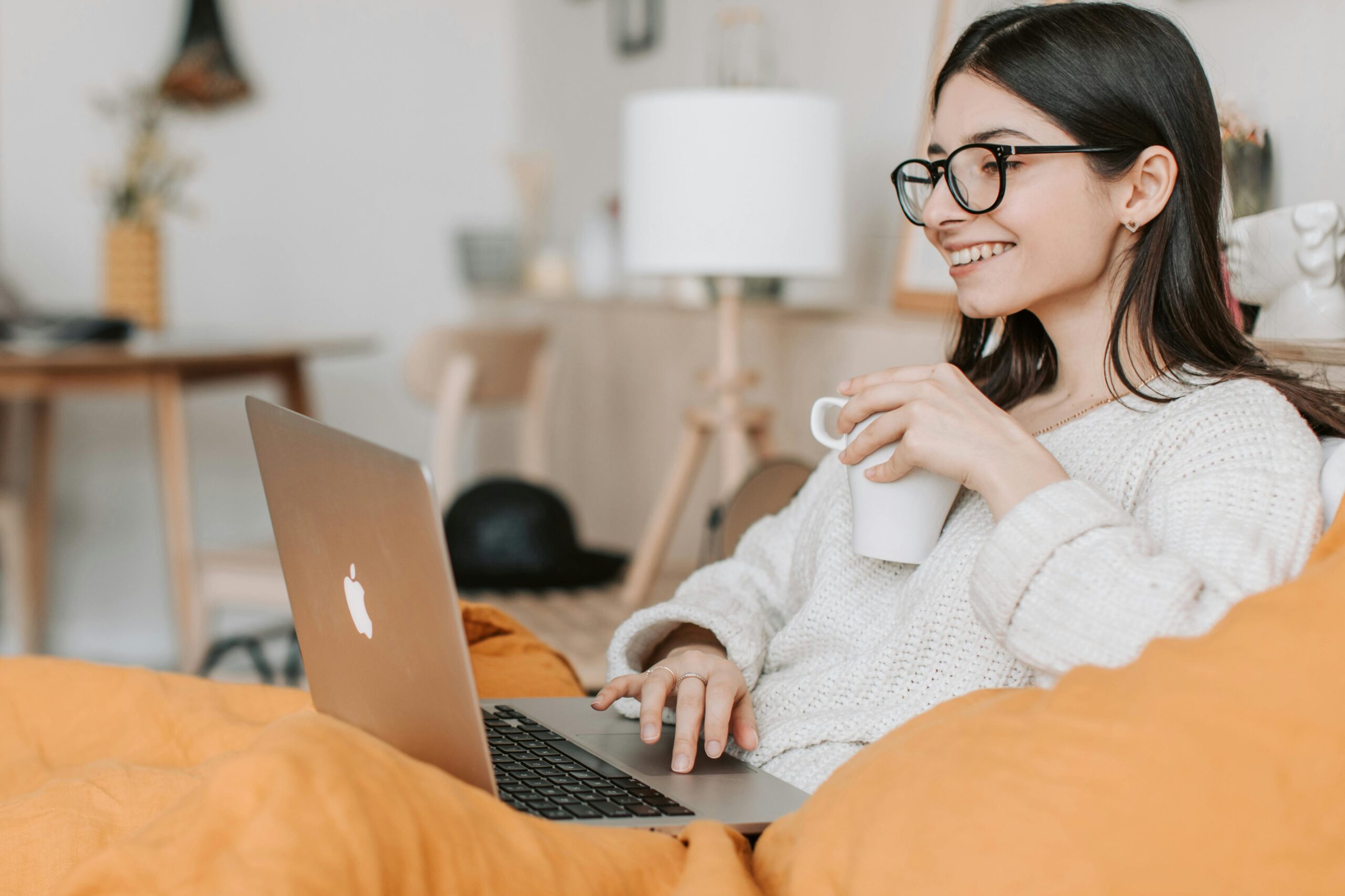A product manager on her laptop with coffee