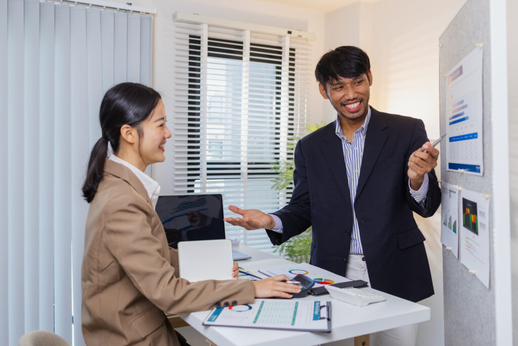 Two young professionals getting into sales